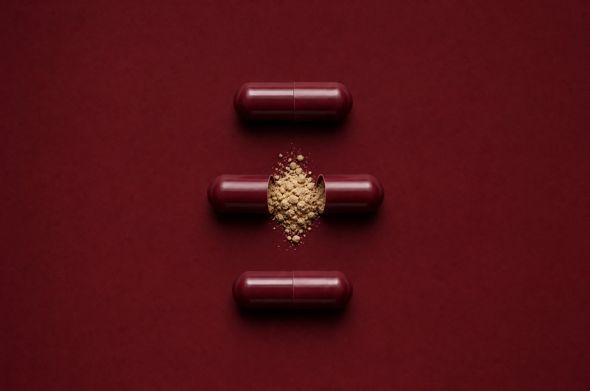 Anchor capsule anatomy, oxblood red shell with beige powder