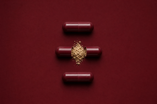 Anchor capsule anatomy, oxblood red shell with beige powder